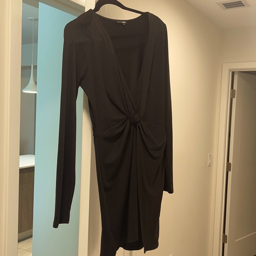 Black short dress, with a slit.